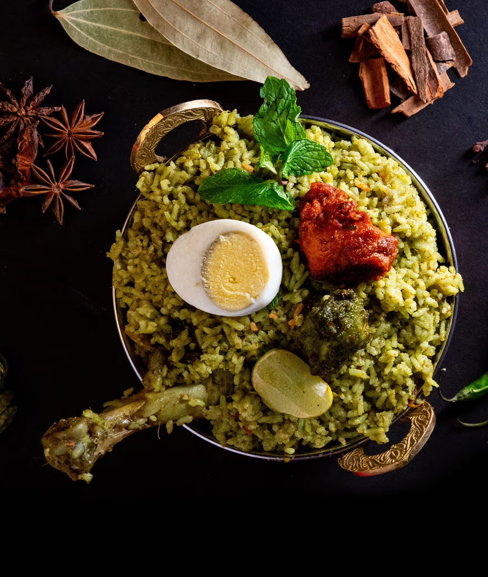 Aromatic Gowda-style biryani with tandoori chicken, egg and whole spices